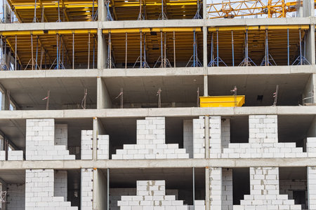 Construction of buildings using monolithic technology. Reinforced concrete frame of the building,...