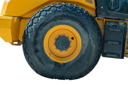 the big new road grader wheel on white backgroundの写真素材