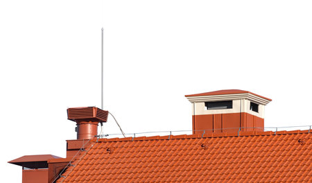 house with a roof from shingles with a pipe on white backgroundの写真素材