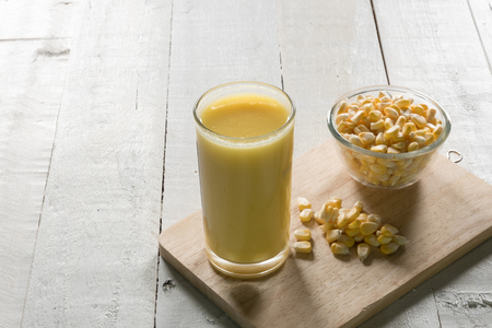 Corn juice on wood background food vitaminsの写真素材