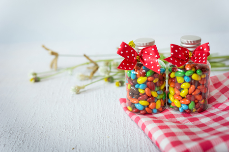 Baby Gift Colorful candies in jar on tableの写真素材
