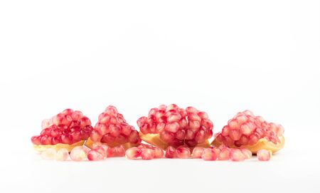Ripe pomegranates with leaves isolated on a white background.の写真素材