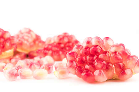 Ripe pomegranates with leaves isolated on a white background.の写真素材