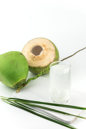 Fresh coconut drink with young coconut on white background