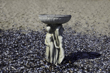 vintage cup on sand with shells on Odessa beachの写真素材