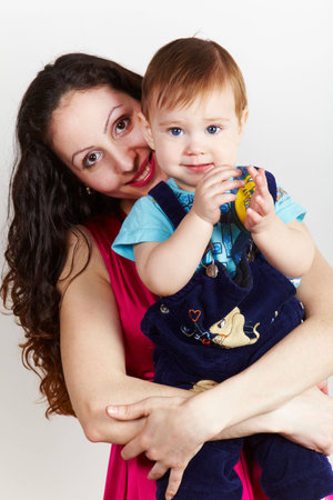 Mother with son carring on handsの写真素材