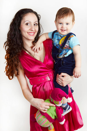 Mother with son carring on hands with toyの写真素材