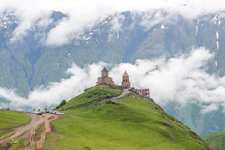 Gergeti Trinity Church in the mountains of the Caucasus.の写真素材