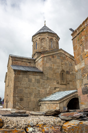 Gergeti Trinity Church in the mountains of the Caucasus.の写真素材