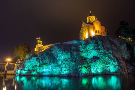 Night view of the church of Metekhi and a statue Vakhtang Gorgasali over the river Mtkvari (Kura), Tbilisi, Georgia.の写真素材