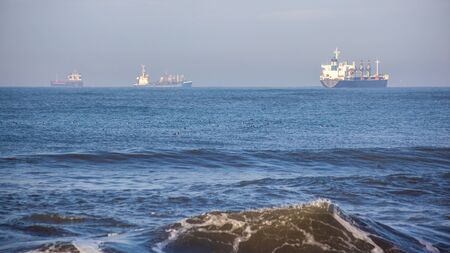Sea wave, ships on the Black Sea, Poti, Georgian coast.