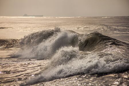 waves of the sea breaking on the beach, Poti, Georgia.