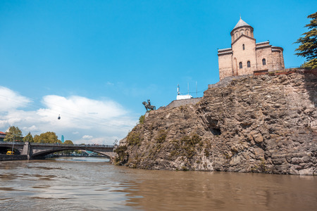 Metekhi church and Houses on the edge of a cliff above the river Kura. Tbilisi, the historic city center.の写真素材
