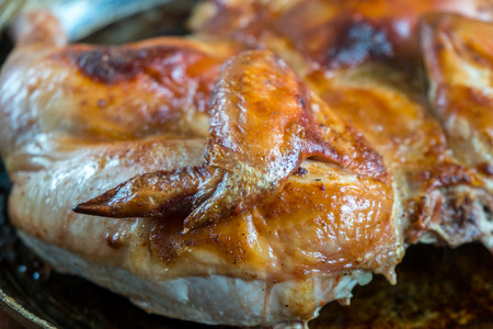 Roasted chicken on iron pan, homemade food.の写真素材