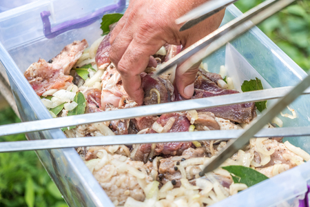 preparing pork shashlik on the countryside.の写真素材