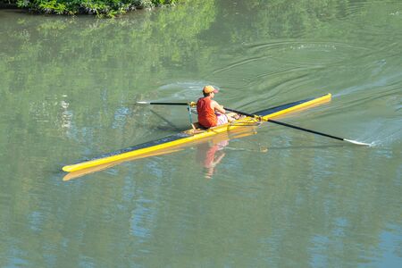 Teenage sportsmen in a boat, rowing on the river Rioni, Poti, Georgia.