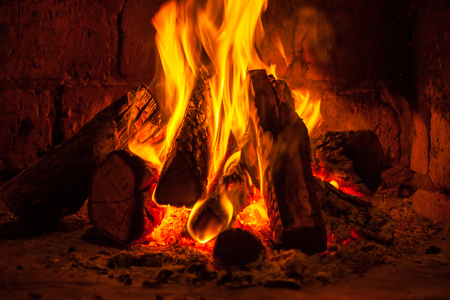 A fire burns in a fireplace, Fire to keep warm.の写真素材