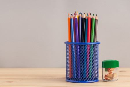 Colored pencils in the blue box on gray background.の写真素材