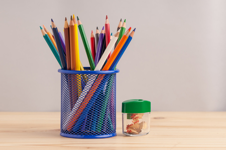 Colored pencils in the blue box on gray background.の写真素材