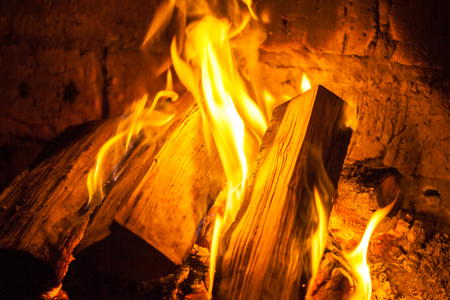 A fire burns in a fireplace, Fire to keep warm.の写真素材