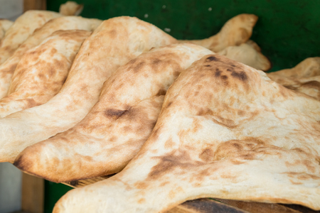 Georgian traditional brick oven. Traditional georgian breads. Cooking bread. Bakery.の写真素材