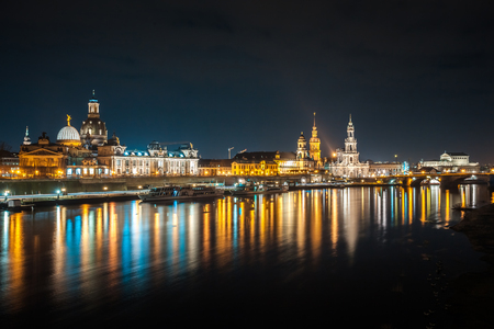 Beautiful night view of the city and reflections in the Elbe river in Dresden, Germany.の写真素材