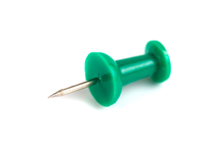 green push-pin isolated on the white background.の写真素材