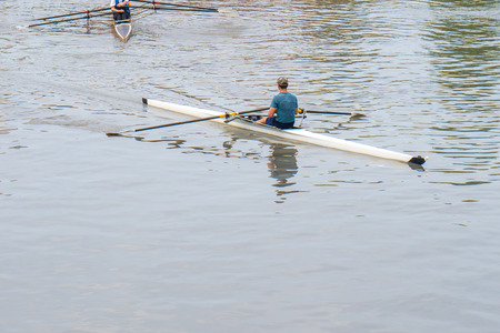 Young sportsmen in a boat, rowing on the river Rioni, Poti, Georgia.
