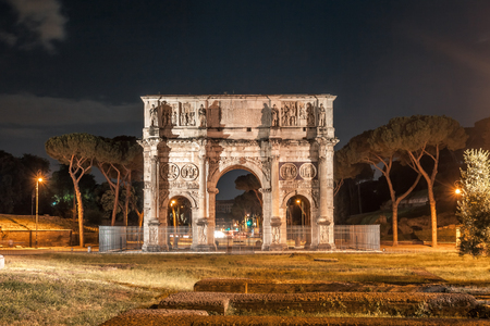 Antique arch of Constantine in Rome at night, Italy.の写真素材
