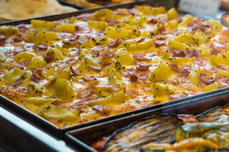 texture of vegetarian pizza on the bench of the city of venice.の写真素材