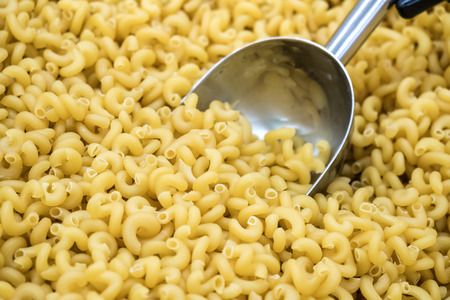 italian pasta with spoon at market, food.の写真素材