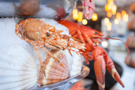 Outdoor Fish Market with Crab and Shrimp on ice, Paris, France.の写真素材
