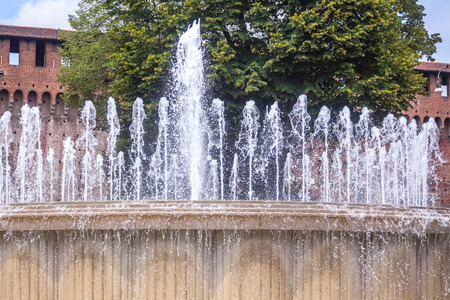 Fountain in front of the Sforza castle in Milan, Italy.の写真素材