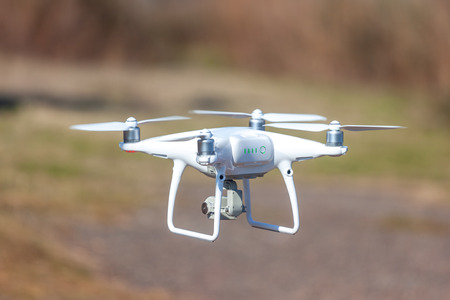 flying drone close above ground, modern technology