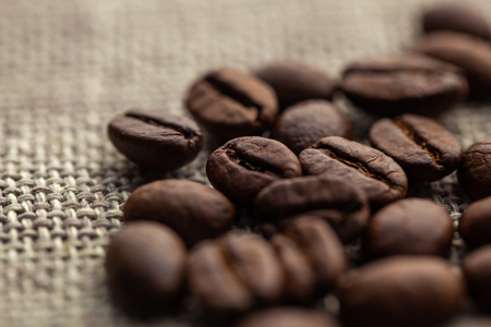 Close up of coffee beans on cloth sack, food and drinkの写真素材