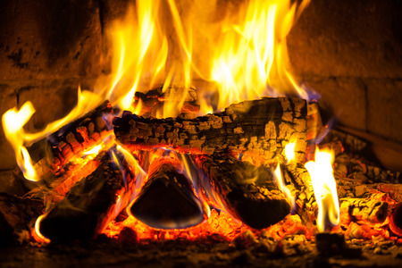 Wood burning in a cozy fireplace at homeの写真素材