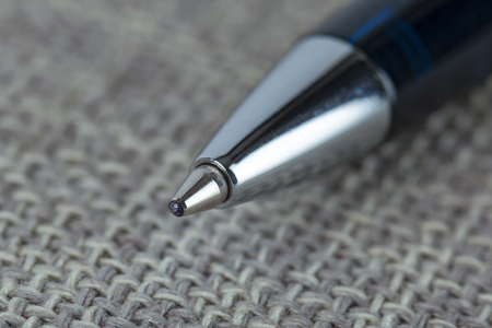 Ballpoint pen on the sack cloth, selective focus on the ball, ojectの写真素材