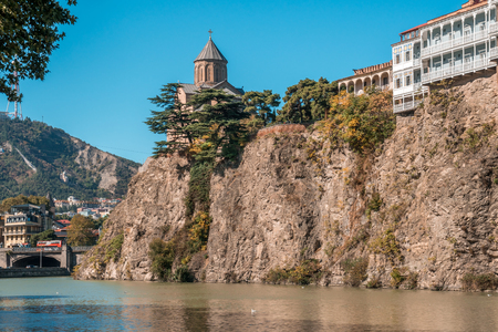 Metekhi church and Houses on the edge of a cliff above the river Kura. Tbilisi, the historic city center, Georgiaのeditorial素材