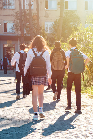 Group of kids going to school together, back to school, educationの写真素材