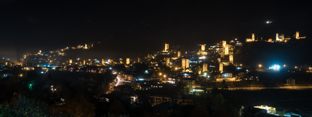 View of Svan towers with night illumination in Mestia village at night. Upper Svaneti, Georgiaの写真素材