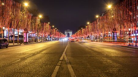 Avenue des Champs Elysees and Arc de Triomphe at night, Paris. France.の写真素材