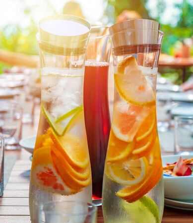 Refreshing orange and cherry summer drinks on the table. Healthy drinks.の写真素材