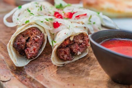 Kebab. Traditional middle eastern, arabic or mediterranean meat kebab with vegetables and herbs. Food.の写真素材