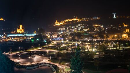 Night view of old Tbilisi. Narikala Fortress and other landmarks of the city. Travel.