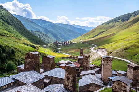 View of the Ushguli village at the foot of Mt. Shkhara. Picturesque and gorgeous scene. Rock towers...