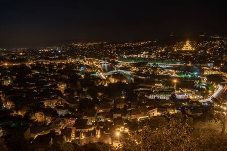 Night view of Tbilisi with Sameba (Trinity) Church and other landmarks. Beautiful Place to travel. Georgiaの写真素材