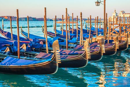Gondolas by Saint Mark square at sunrise, Venice, Italy. Travel.の写真素材