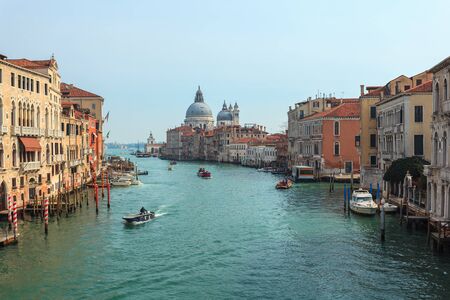 View of Canal Grande. Various boats float by a fine architectural complex of embankments. Travel.の写真素材