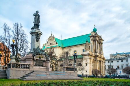 Mickiewicz Monument and Church of the Assumption of the Virgin Mary and of St. Joseph known as the Carmelite Church. Travel.の写真素材