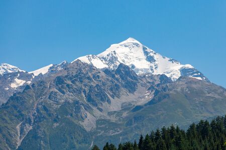 Mount Tetnuldi rises above the Great Caucasian Range in the upper Svaneti in Georgia, Mountain Landscape. Travel.の写真素材